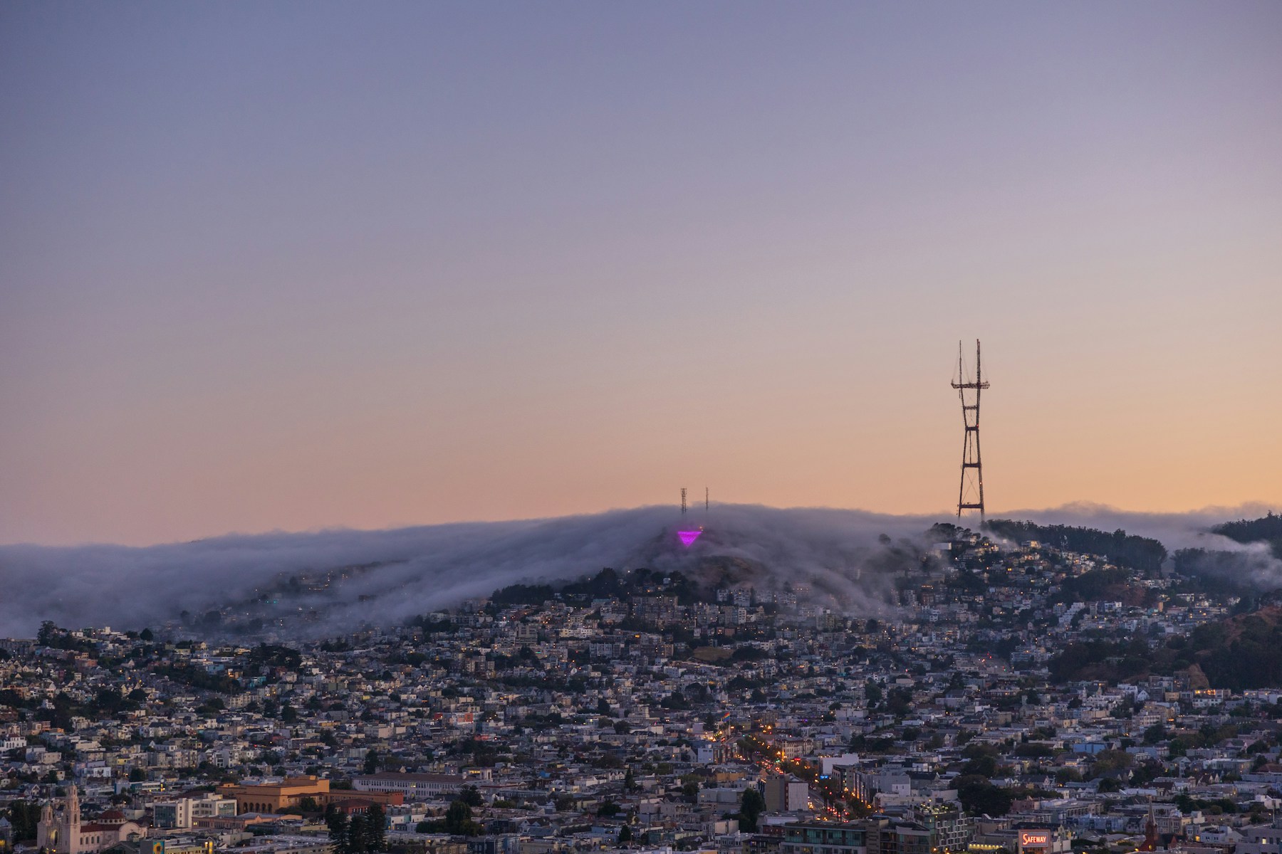 a city with a tower in the distance